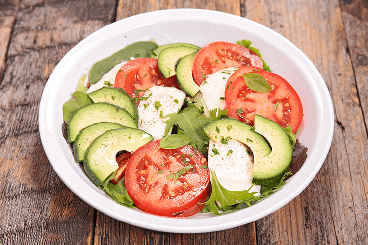 salad with tomatoes and avacados and fresh greens